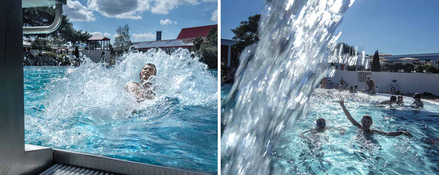 Freibad im Sommer mit Startblock und Wasserfontäne